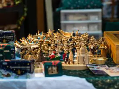 Wooden figures on display at a vendor booth