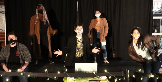 Couple singing at microphone at a concert