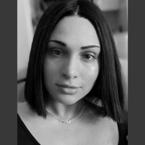 Black and white photo of a woman looking at the camera