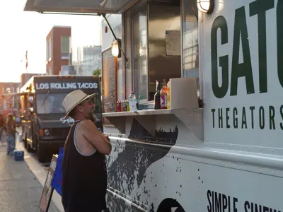 person ordering food from a food truck