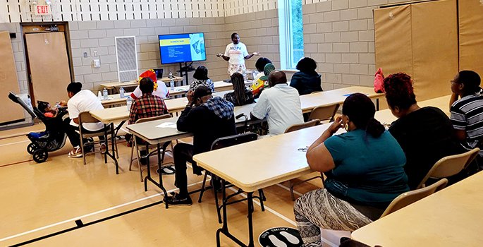 Group of people at workshop from teacher angle