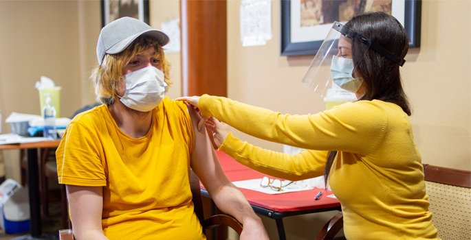 Person receiving vaccination