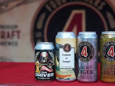 canned beers lined up on bar