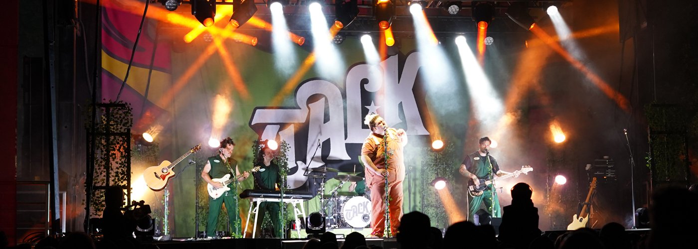 Performer, TALK, on stage with crowd