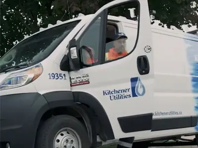 Man stepping out of Kitchener Utilities van