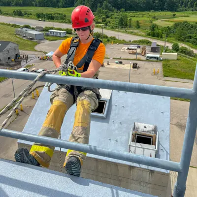 Participant learning about harnesses during an interactive training session 