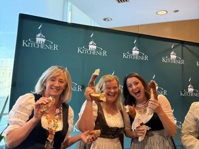 Councillors posing with pretzels at Oktoberfest