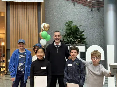 Councillor posing with kids for photo