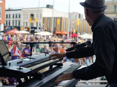 performing play keyboard in front of large audience