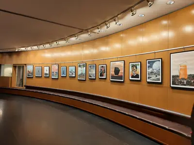 Surrealist, contemporary artwork hanging on the wall of the Rotunda Gallery