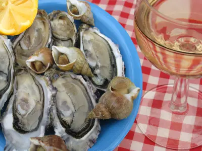 mussels and beer on a checkered table cloth