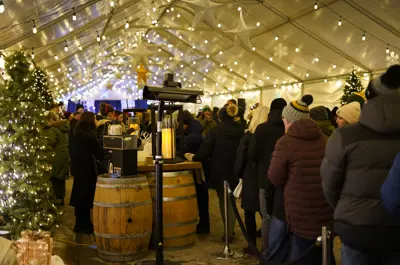 Patrons walking inside the main tent at Christkindl Market